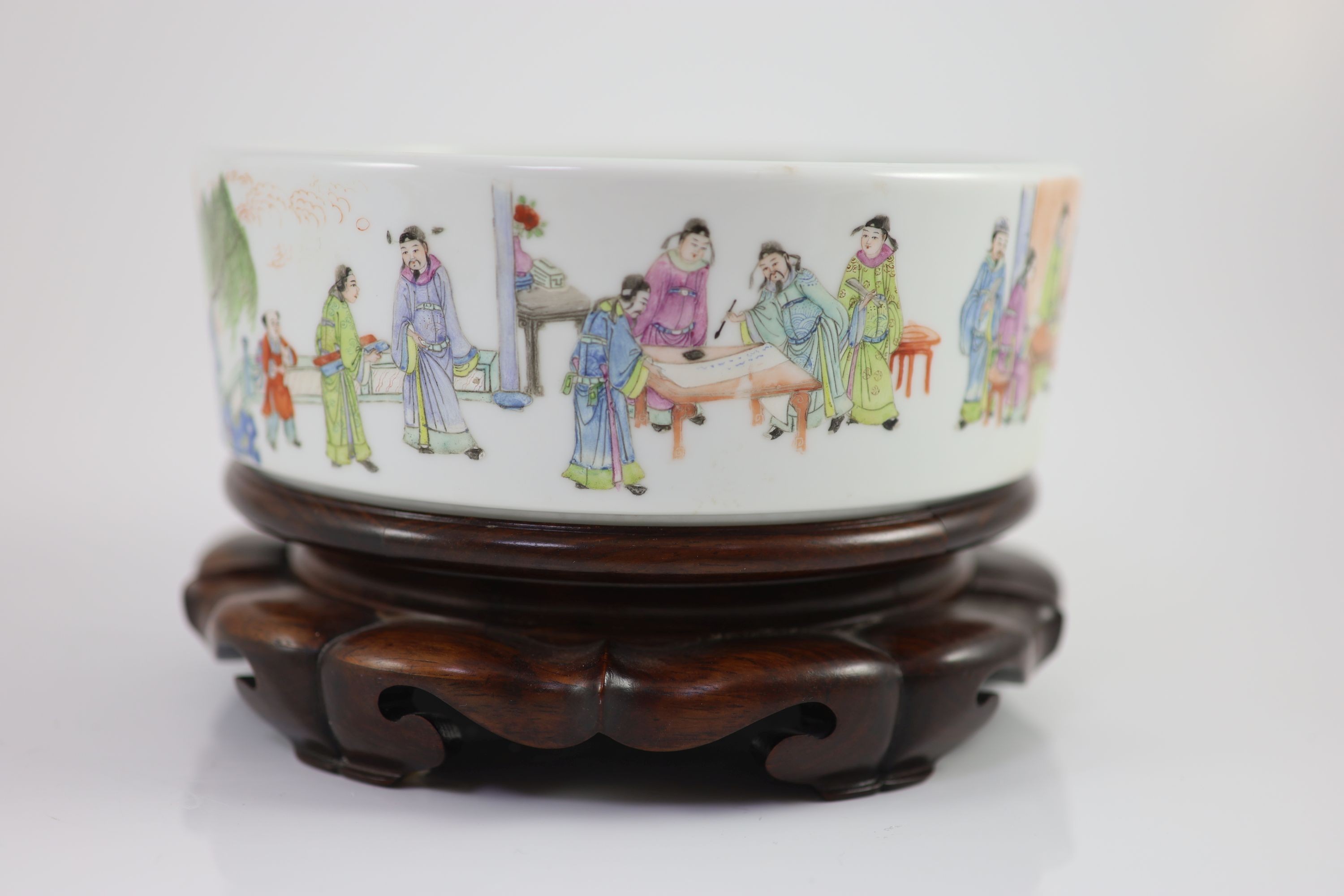 A Chinese famille rose cylindrical bowl, Yongzheng mark but Republic period, 19cm diameter, 7cm high, wood stand